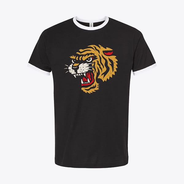 Black ringer tee with white bands featuring a weathered yellow and red traditional tiger head graphic, styled in an 80s analog photography aesthetic.